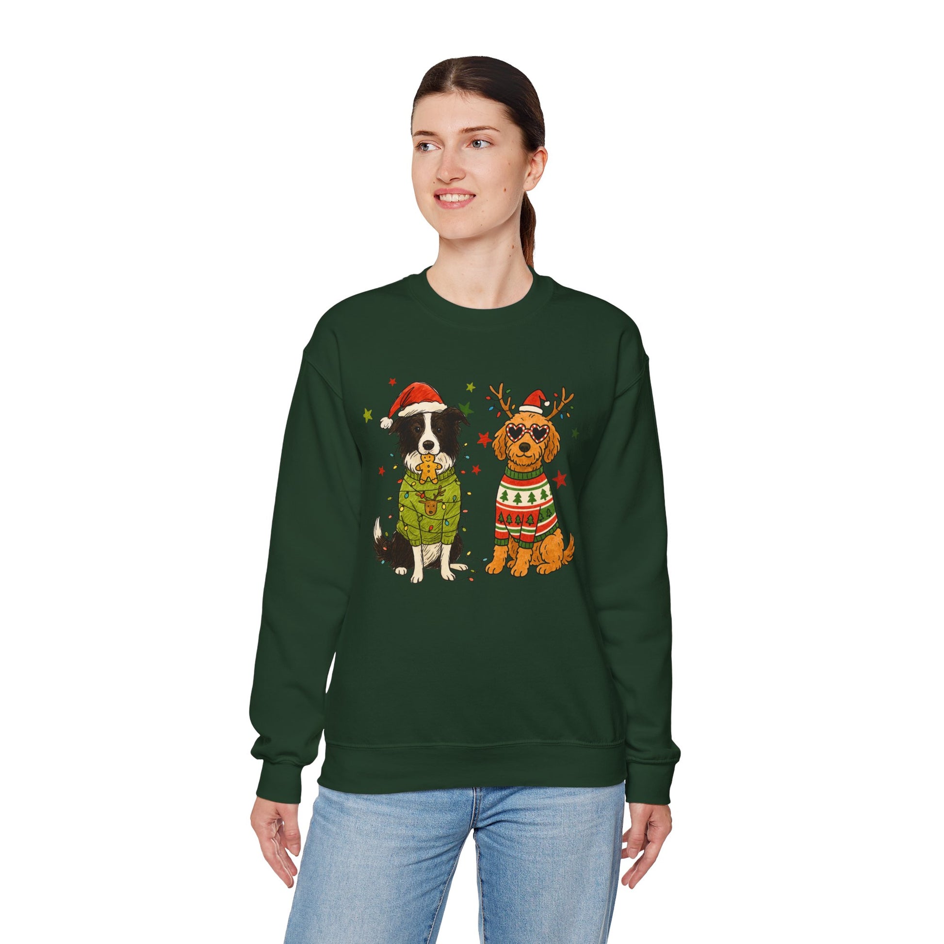 Forest green unisex crewneck with two dogs in holiday sweaters and “Merry Christmas” text, centered graphic