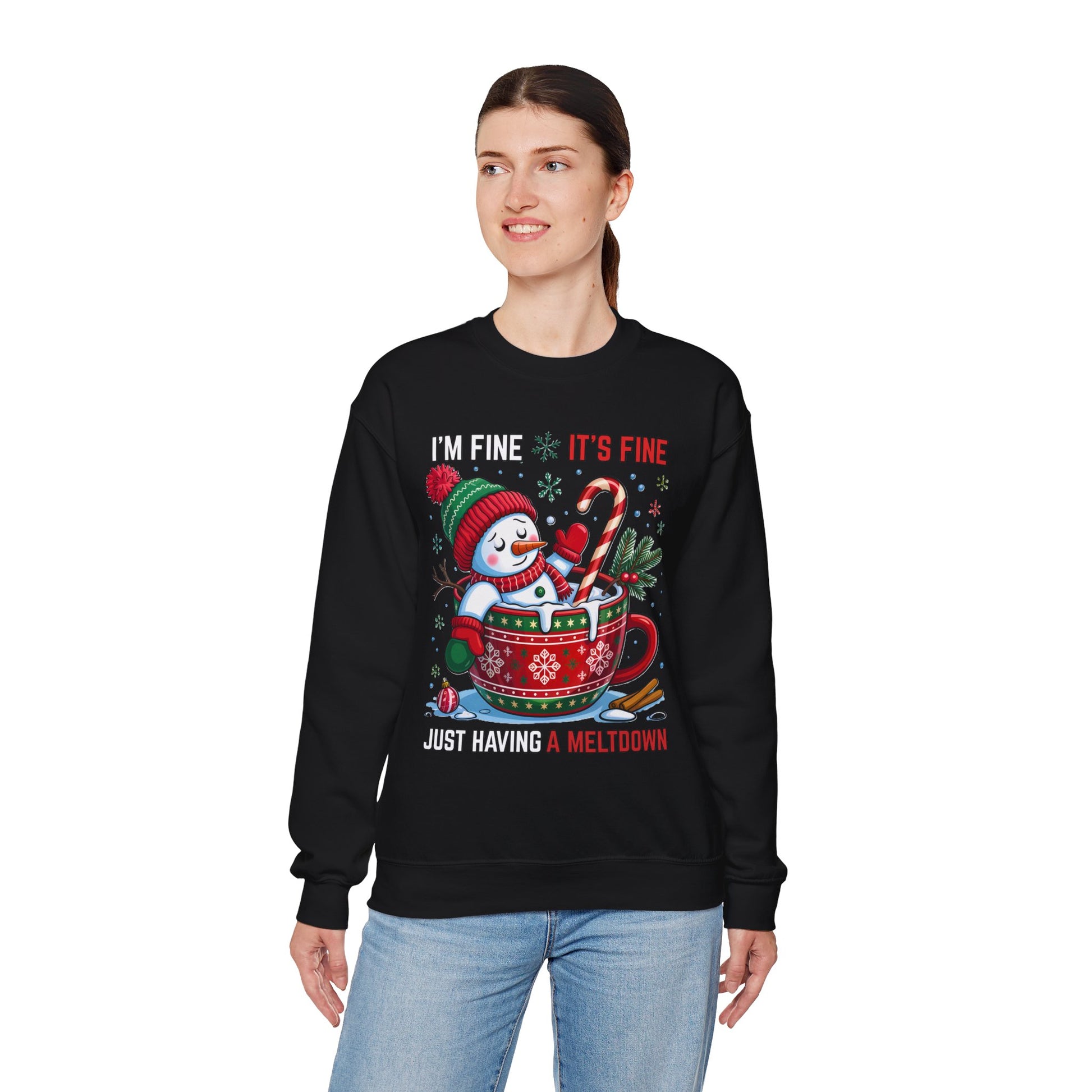black crewneck featuring “I’m Fine It’s Fine” text above Santa melting in mug, ribbed collar and cuffs visible